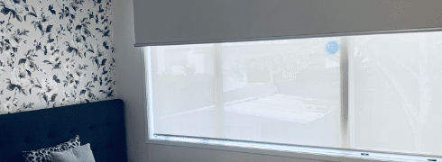 Room with dual roller blinds