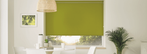 Living room with green motorised roller blinds