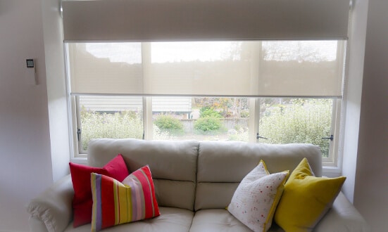 Room with roller blinds designed by Home Vision Blinds.