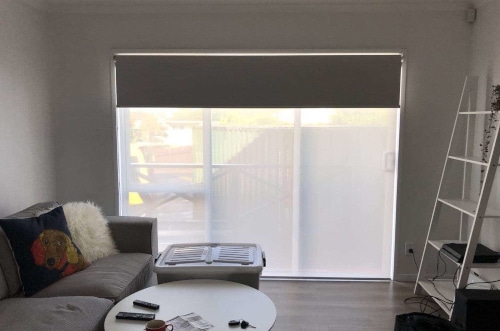 Home Vision Blinds client's spare room/entertainment kids room with dual double roller blinds Auckland.