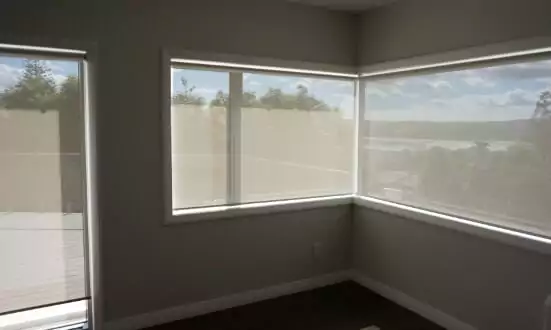 Room with roller blinds designed by Home Vision Blinds.